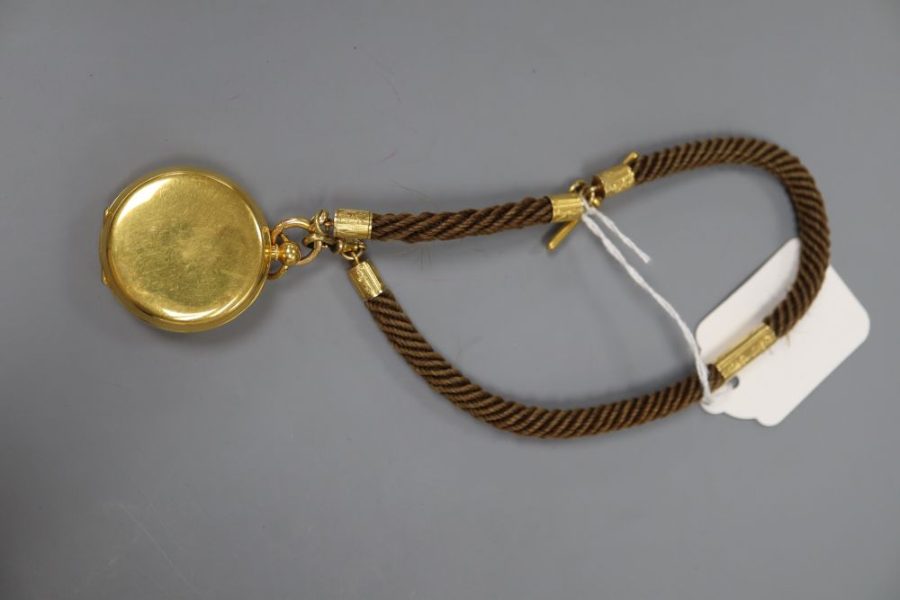 A Victorian yellow metal mounted plaited hair albert, with a later gold plated Railway Timekeeper pocket watch.